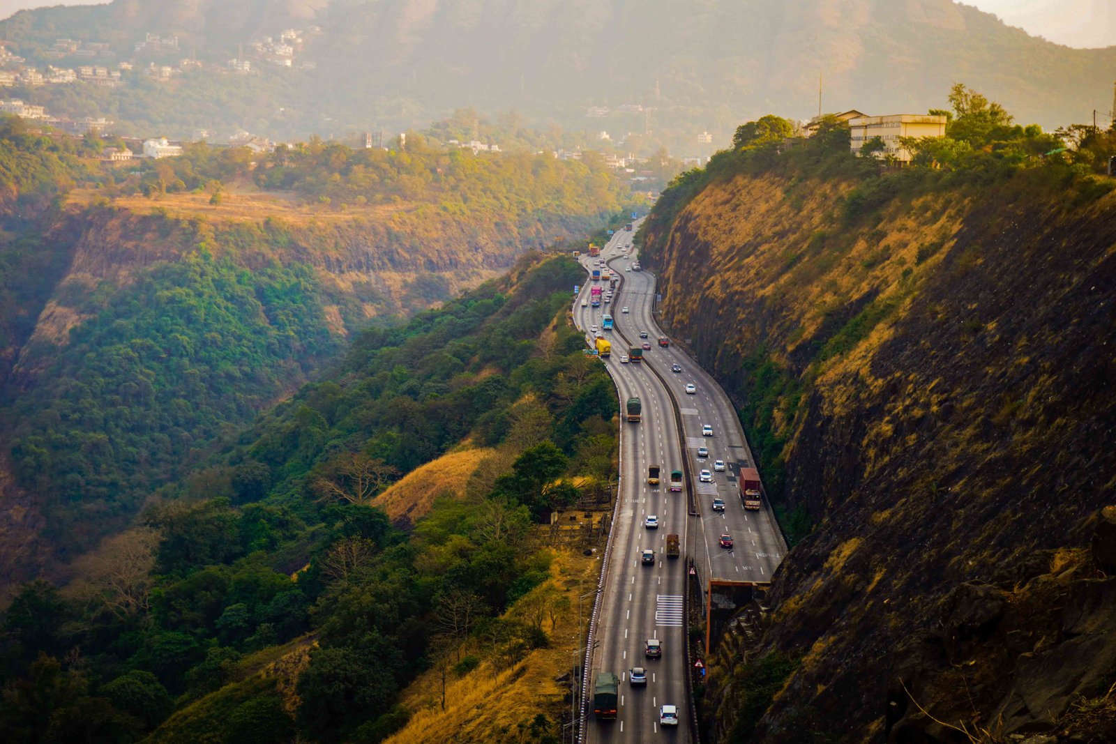 Pune city skyline with a CabFindr cab for local car rental with driver